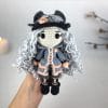 Plush crochet doll amigurumi toy in neutral gray tones, handmade pattern