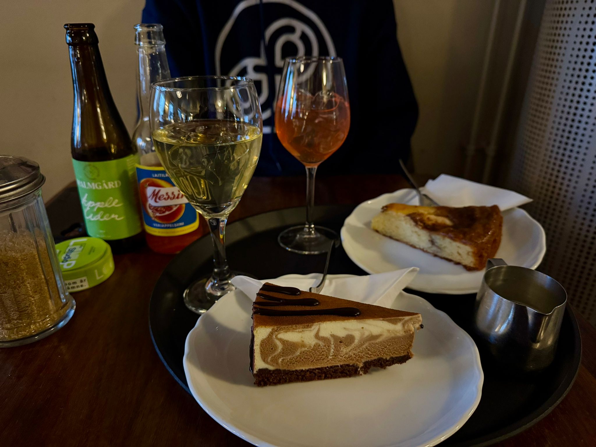 A view of what we ordered at Cafe Engel in Helsinki. I had the chocolate marble cake and Jonatan had apple cake with vanilla custard. I had two Apple ciders that tasted like champagne and he had a Finnish blood orange soda.