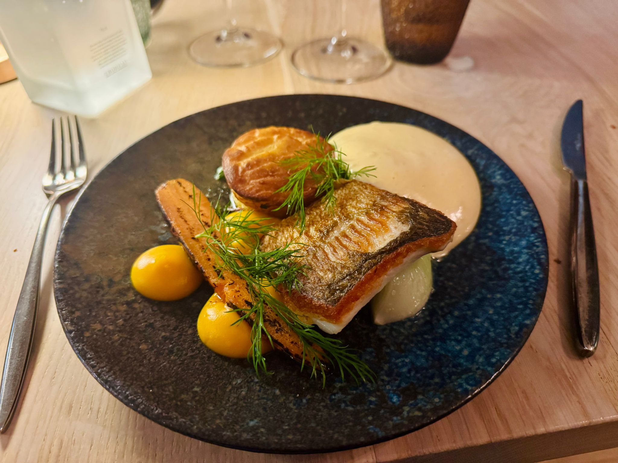 Plate no. 3 at Restaurant RAGU in Helsinki. Whitefish with a potato cake, roasted carrot, carrot cream and hollandaise.