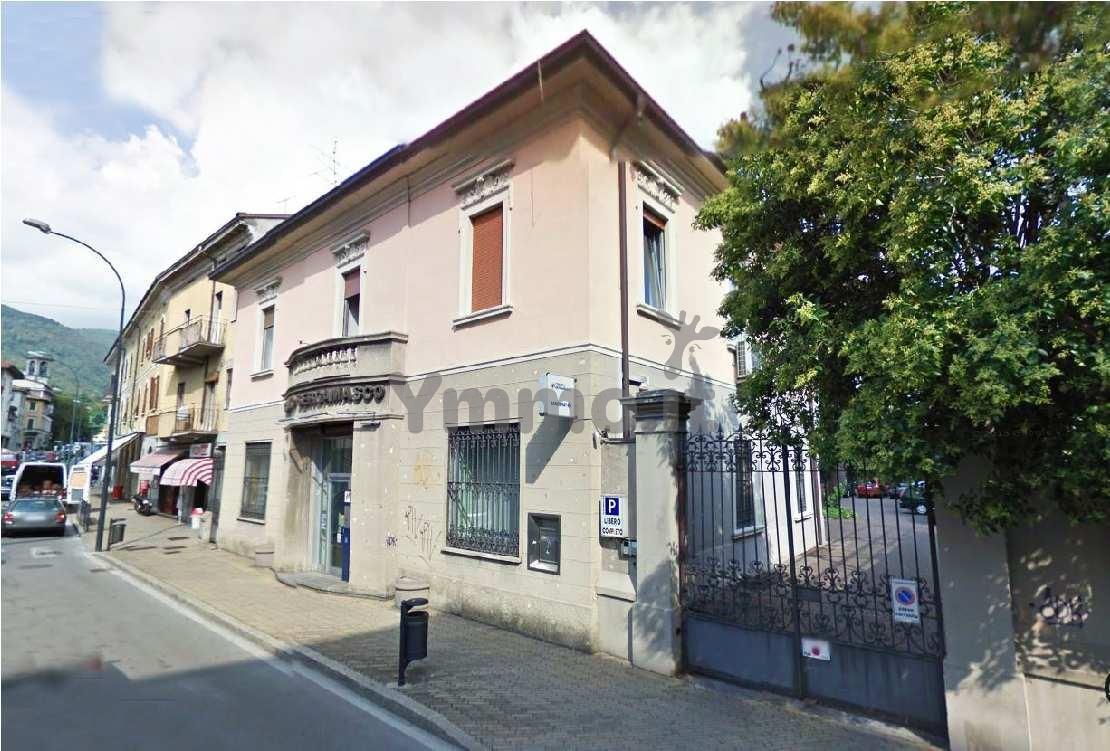 Erba centro - Palazzina a reddito locata a istituto bancario + area edificabile con progetto