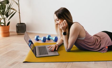 Female freelancer on yoga mat