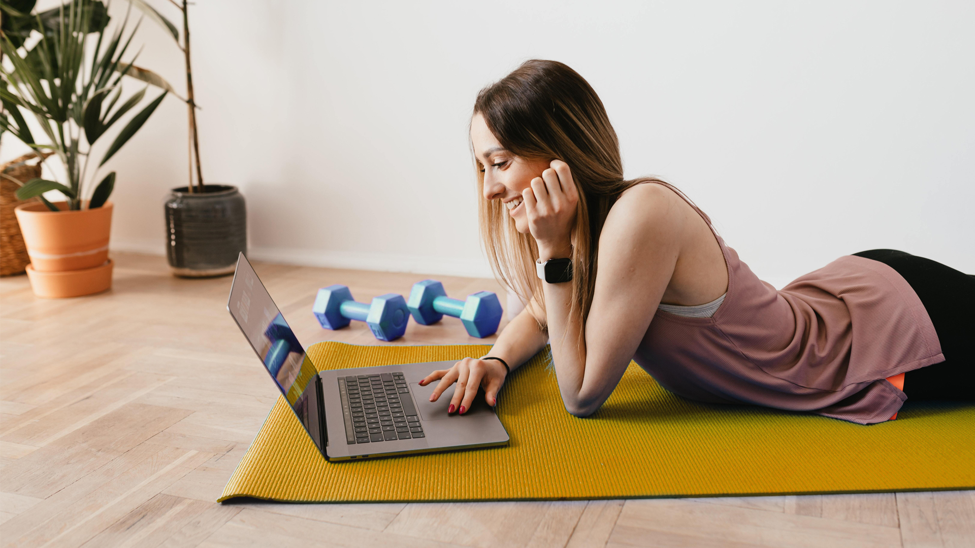 Female freelancer on yoga mat