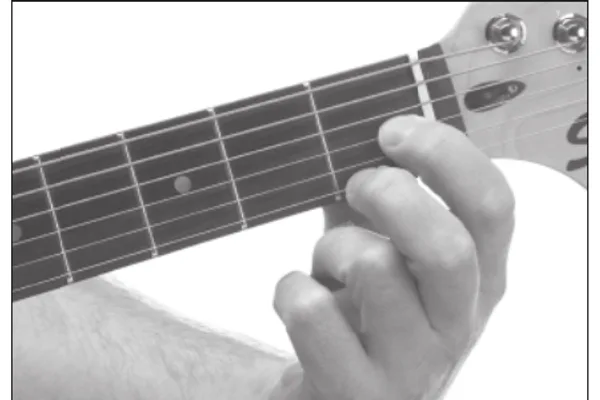 A♭dim7 chord — a hand playing it on the guitar fretboard