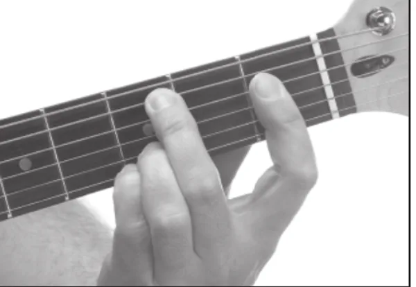 A♭maj7♯11 chord — a hand playing it on the guitar fretboard