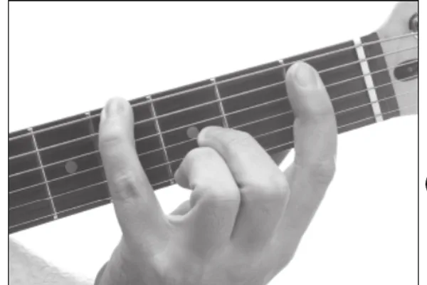 A♭maj9 chord — a hand playing it on the guitar fretboard