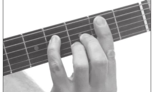 A♭m9♭5 chord — a hand playing it on the guitar fretboard