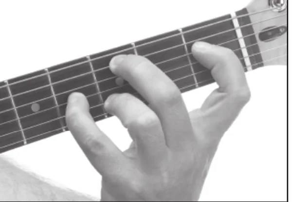 Cm9(maj7) chord — a hand playing it on the guitar fretboard