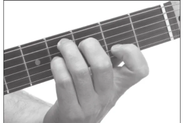 D♭7 chord — a hand playing it on the guitar fretboard