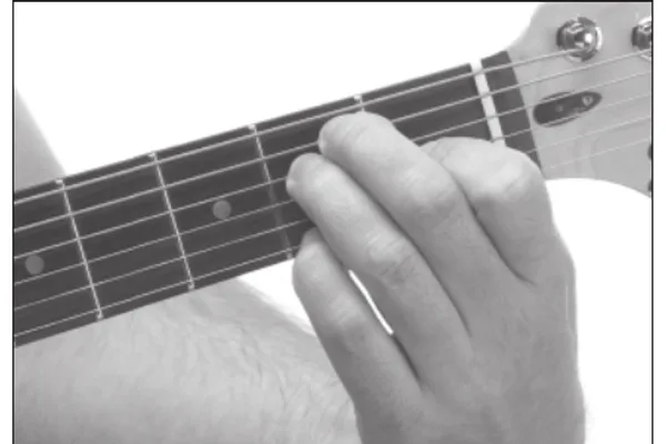 Eadd9 chord — a hand playing it on the guitar fretboard