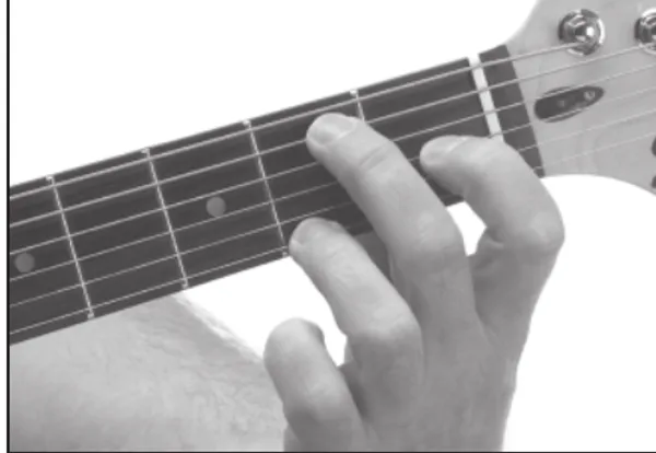 E9 chord — a hand playing it on the guitar fretboard