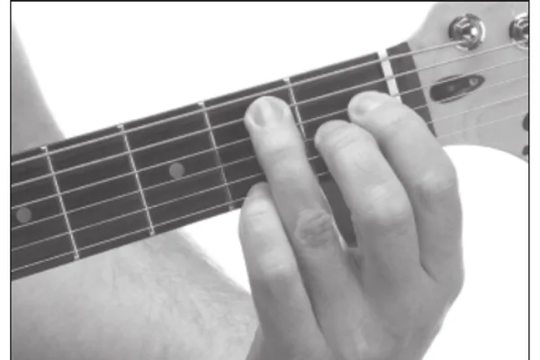 Emaj9 chord — a hand playing it on the guitar fretboard