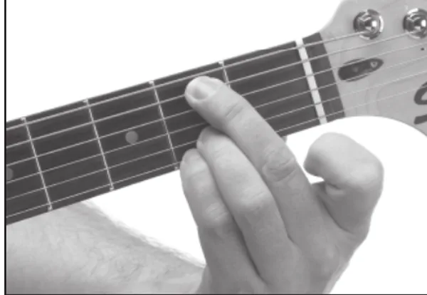 Em13 chord — a hand playing it on the guitar fretboard