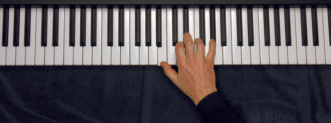 Bdim7 chord played on a piano — hand position on the keys