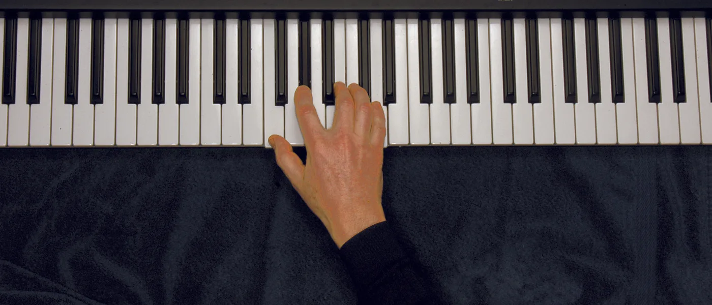 Fdim7 chord played on a piano — hand position on the keys