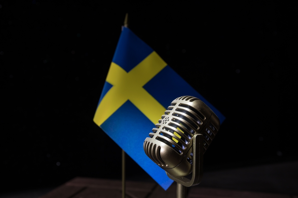 Microphone,On,A,Background,Of,A,Blurry,Flag,Sweden,Close up.