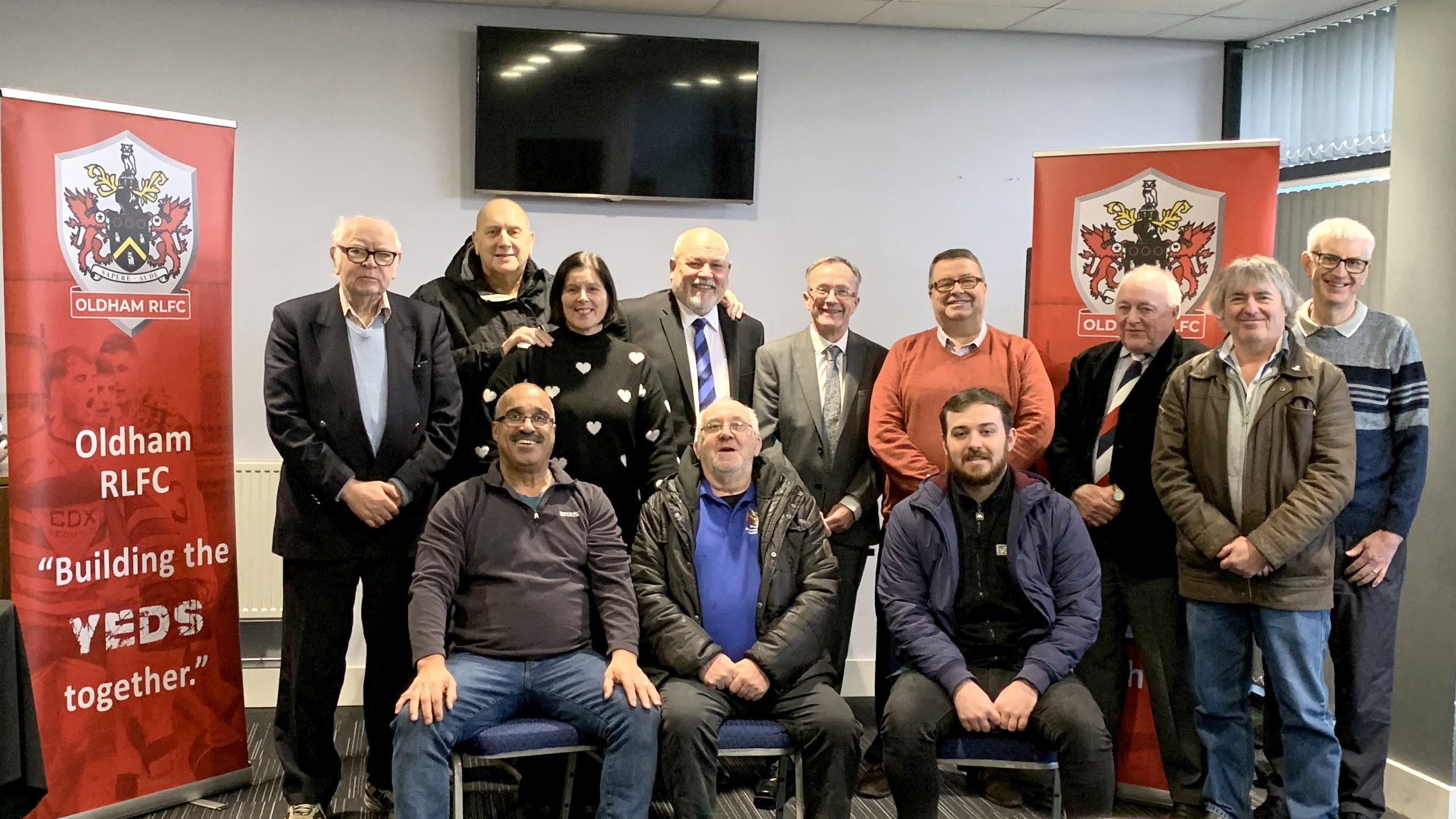 Standing (left to right): Roger Halstead, Adrian Alexander, Ginny Alexander, John Roddy, Harry Catherall (chief executive, Oldham Council), Chris Hamilton, Ian Wilson, Mike Turner, Mike Kivlin. Sitting: Joe Warburton, Phil Bradbury, Jamie Hollingworth