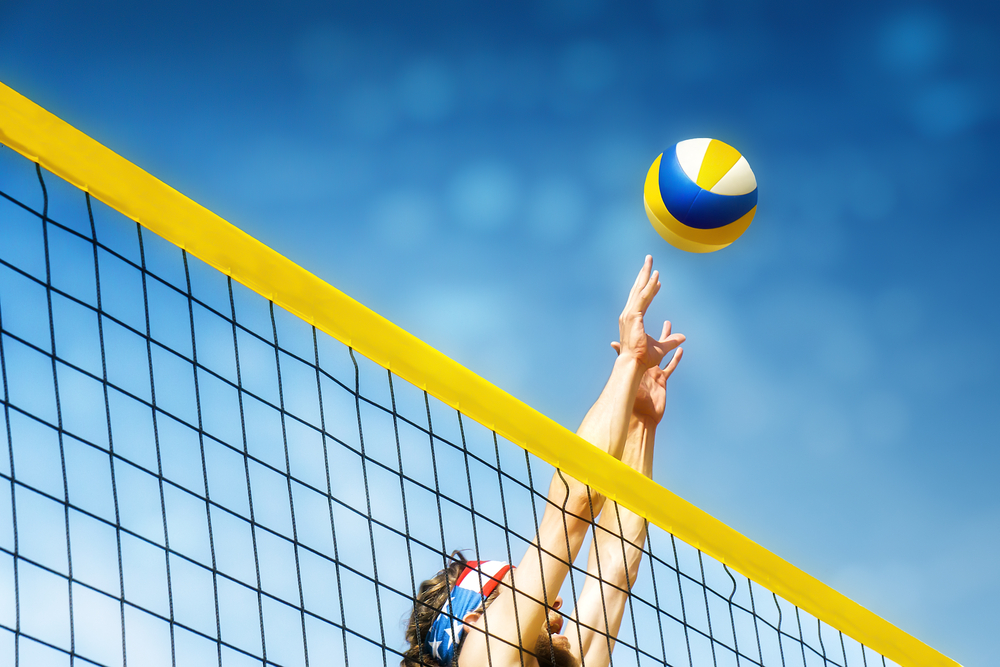 Beach,Volley,Ball,Player,Jumps,On,The,Net,And,Tries