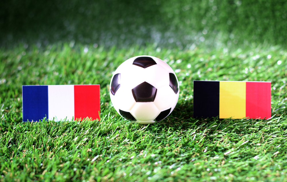 Ball,With,France,Vs,Belgium,Flag,Match,On,Green,Grass