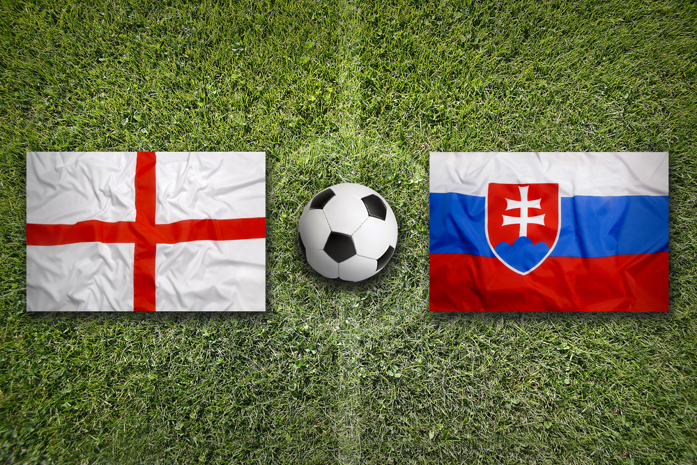 England,Vs.,Slovakia,Flags,On,A,Green,Soccer,Field