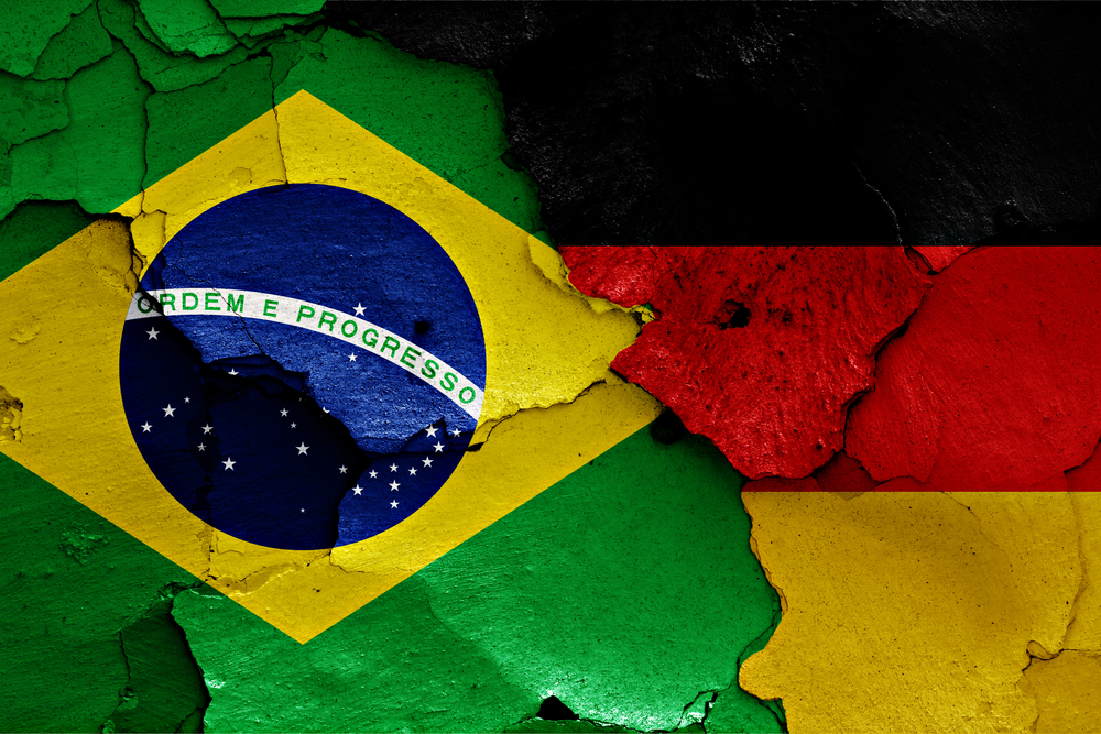 Flags,Of,Brazil,And,Germany,Painted,On,Cracked,Wall,Brasile-Germania