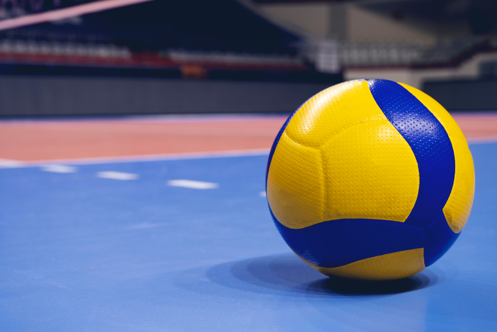 Volleyball,Ball,On,Blurred,Wooden,Parquet,Background.,Banner,,Space,For,Italia-Belgio