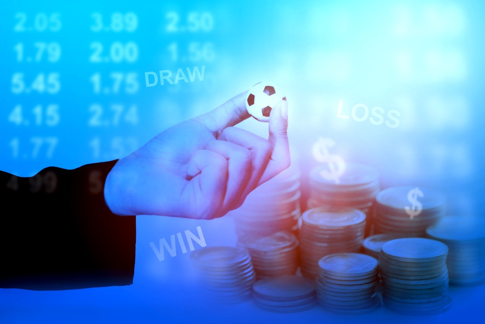 Sport,Betting,On,Soccer,Football,Investment;,Hand,Of,Business,Man