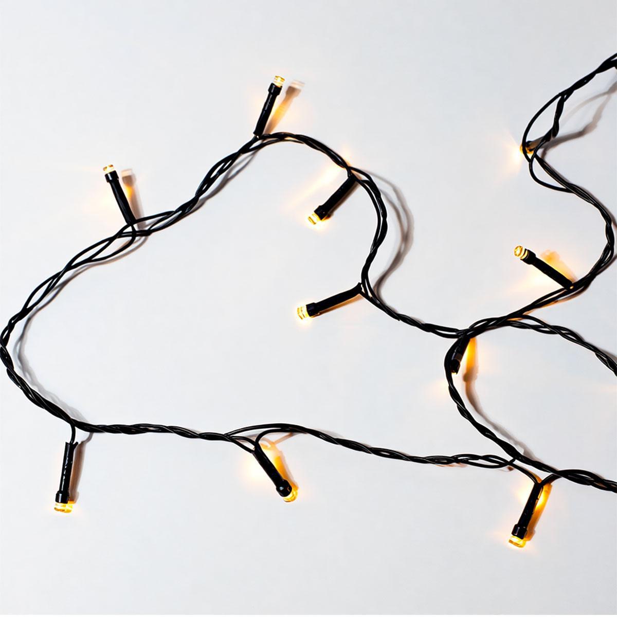гирлянда нитка тёплый жёлтый свет 22 м на чёрном проводе — уют в интерьере