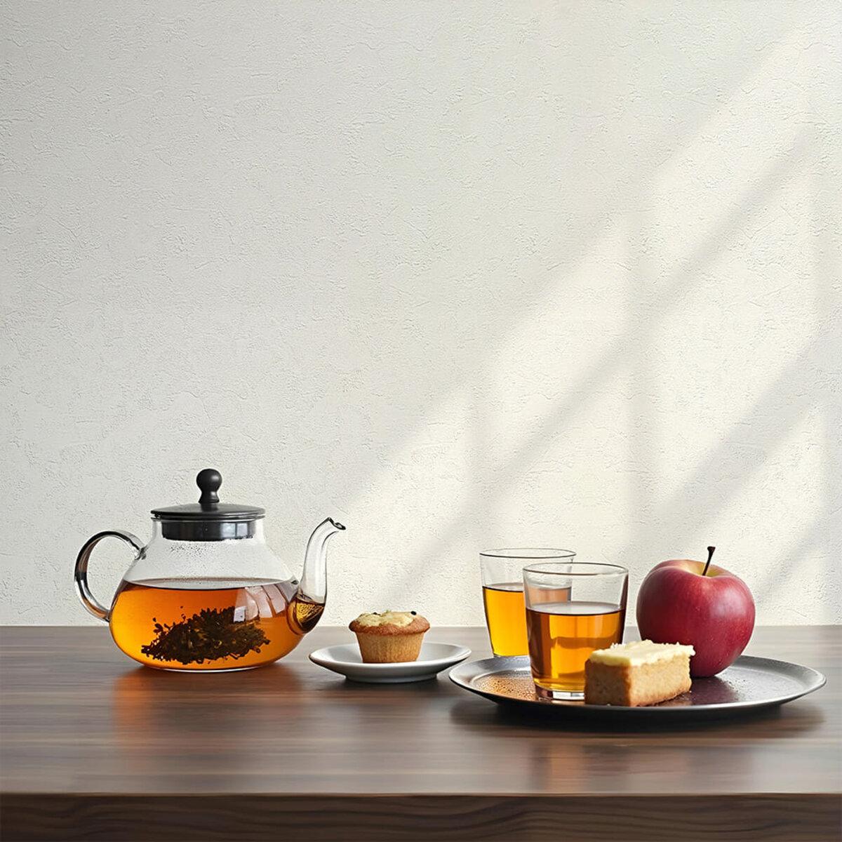 Біла гнучка штукатурка в інтер’єрі на стіні біля столу з посудом