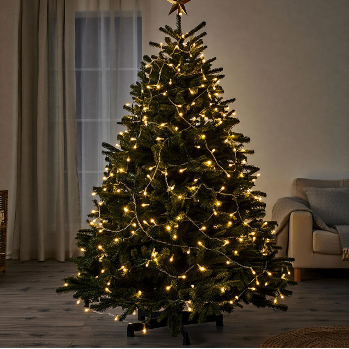 гирлянда нитка 18 м тёплый желтый свет на ёлке в интерьере