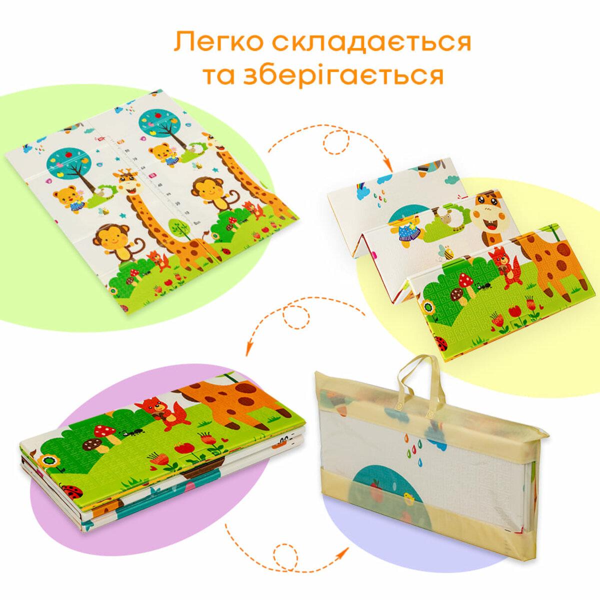 Дитячий складаний термокилимок Лисички-Зростомір у розкладеному вигляді в інтер’єрі біля дивана