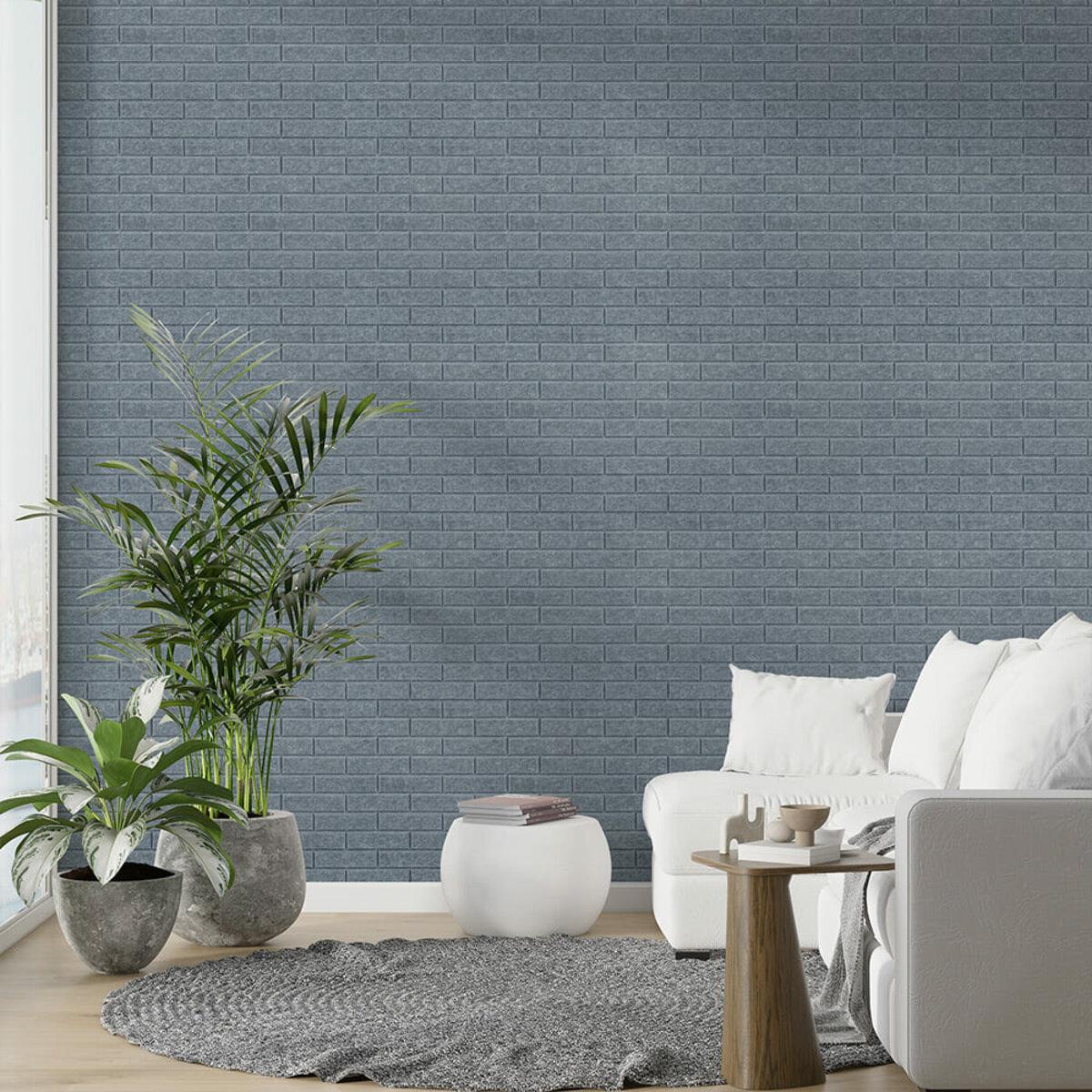 Декоративні акустичні панелі темно-сірі в інтер’єрі вітальні на стіні з 3D-рельєфом під цеглу