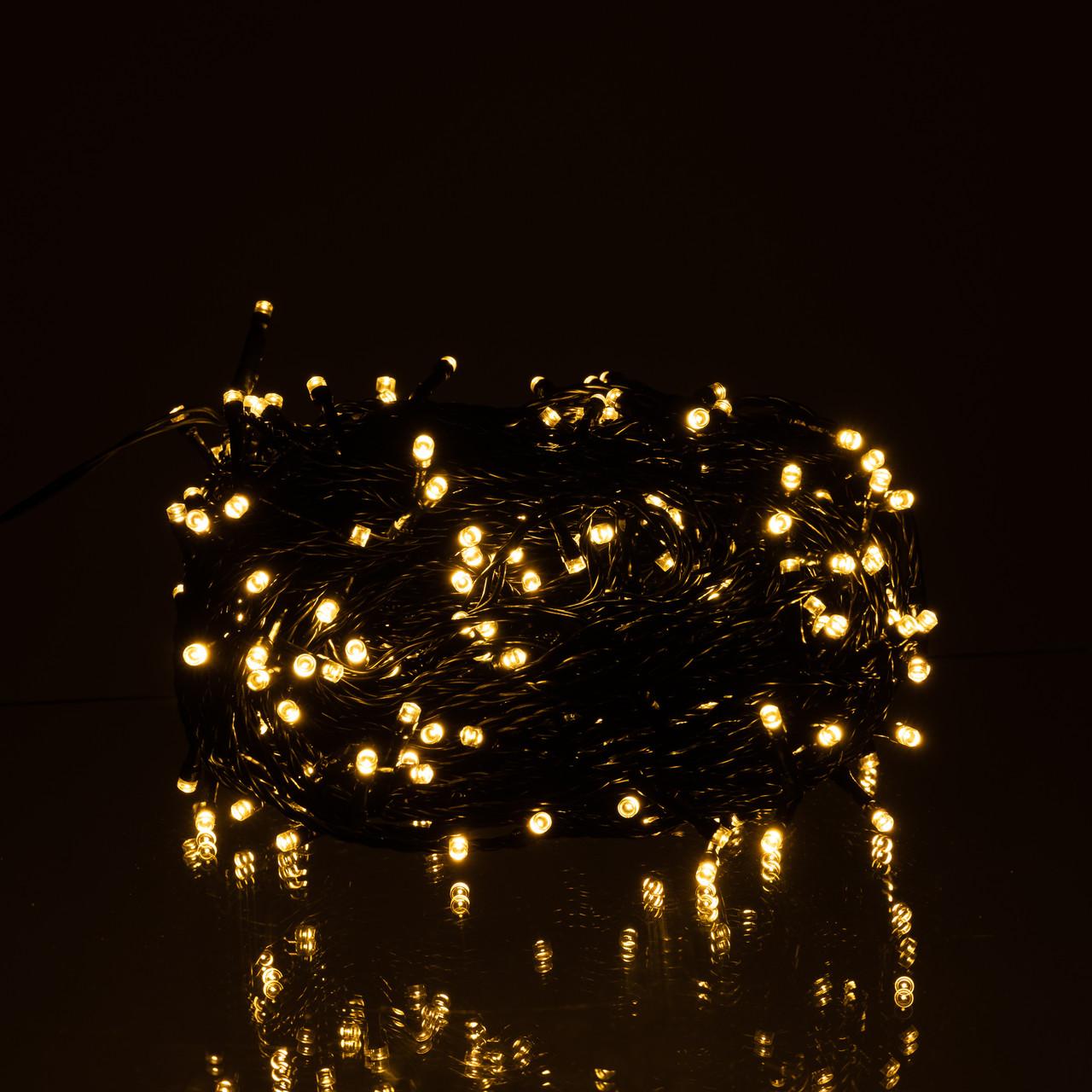 гирлянда нить тёплый желтый свет 300 LED черный провод крупный план